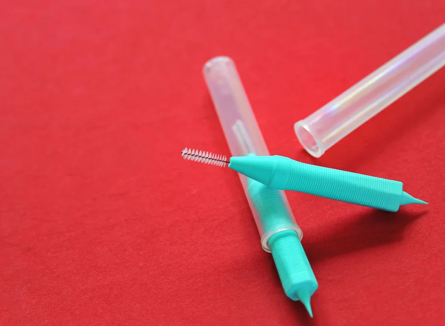 Dental Floss and Interdental Brushes — A Winning Team!