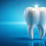 ALT text: A shiny white tooth with a glowing starburst at the top, symbolizing cleanliness and dental health, set against a vibrant blue gradient background. The tooth is polished, reflecting light, and has a smooth, pristine surface.
